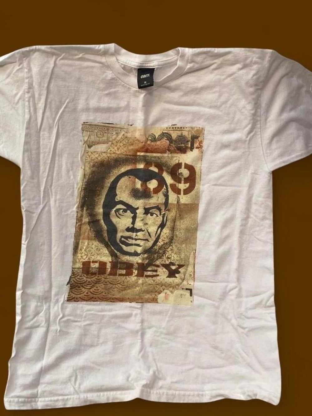 Obey Men’s White Graphic Logo Tee with Brown Vintage Print